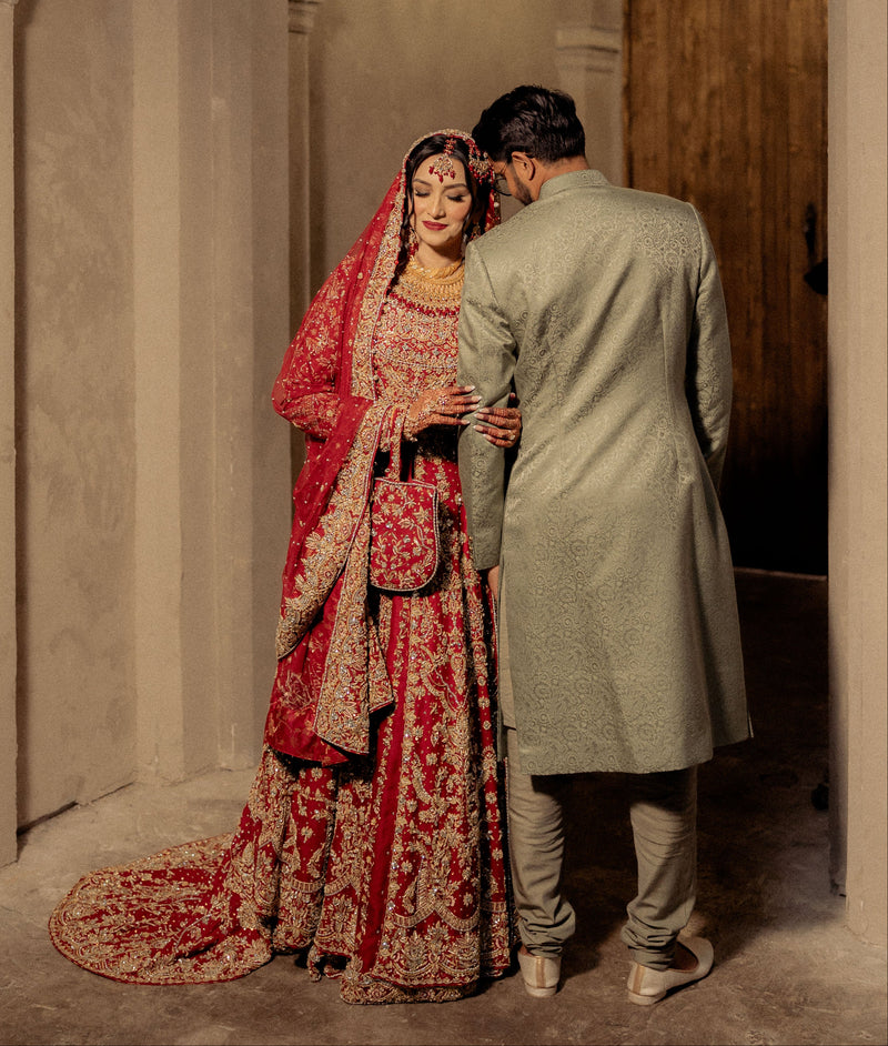 Bride in a red and gold farshi bridal with zardozi embroidery, by Karigur, Toronto