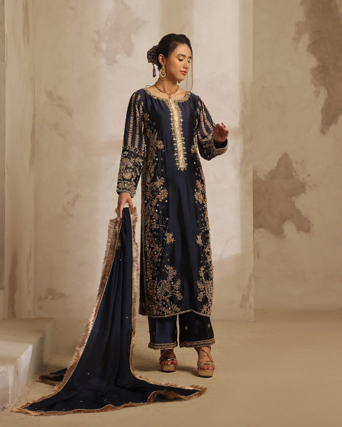 Karigur Dania navy silk suit — close detail of rosegold dabka, gold nakshi, mirror and pearl embroidery on the bodice.