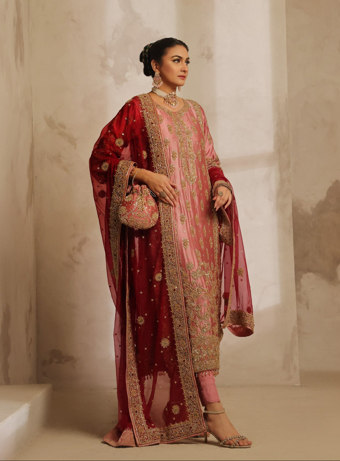 Karigur Nayira pink silk suit — close detail of gold dabka and sequin floral embroidery on the bodice and sleeve.
