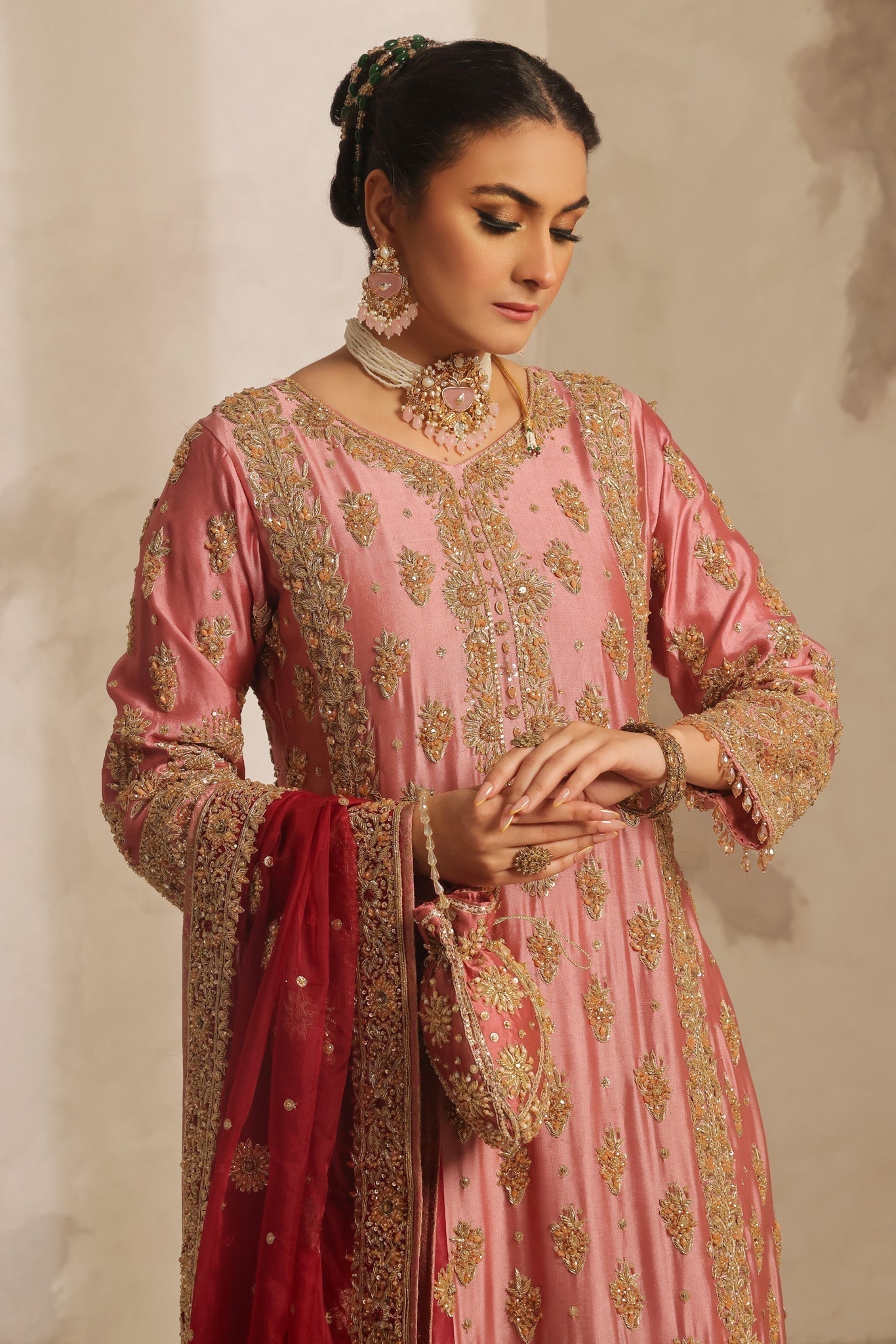 Karigur Nayira — full-length rose-pink bridal suit with matching silk pants and an organza dupatta.