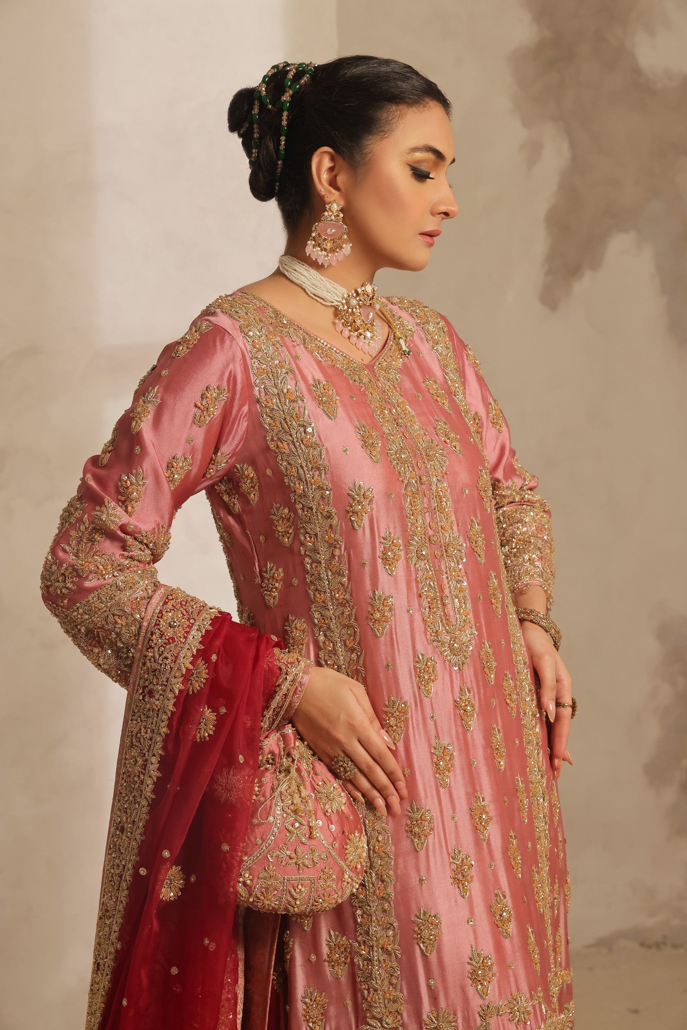 Karigur Nayira pink silk suit, side view showing gold embroidered panels and sleeve detail.