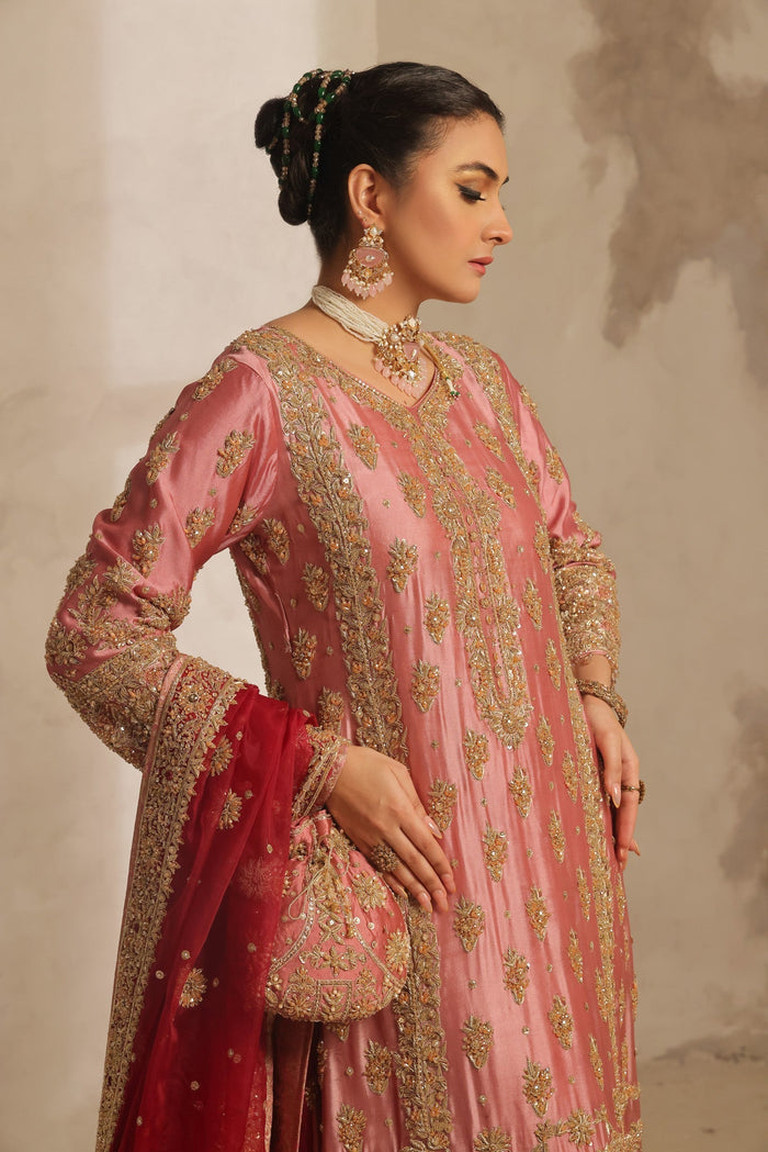 Karigur Nayira pink silk suit, side view showing gold embroidered panels and sleeve detail.