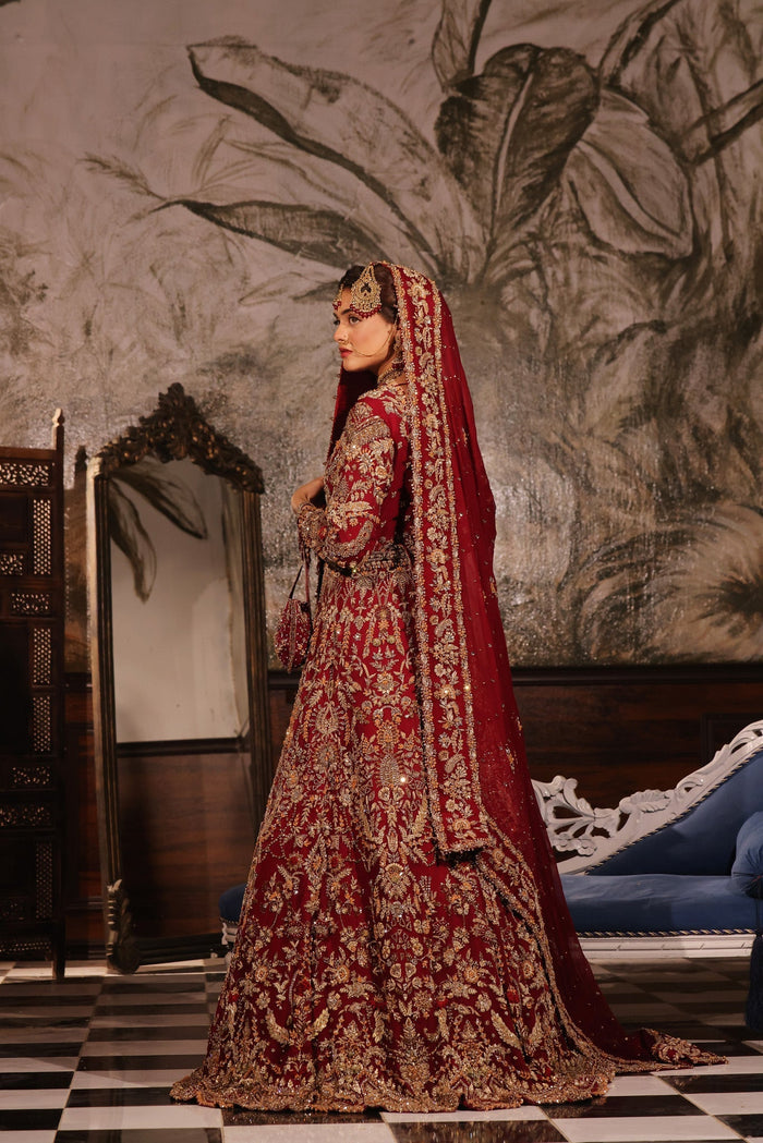 Karigur Ruhani red bridal gown — close detail of gold zardozi, sequin and rhinestone embroidery on the bodice.