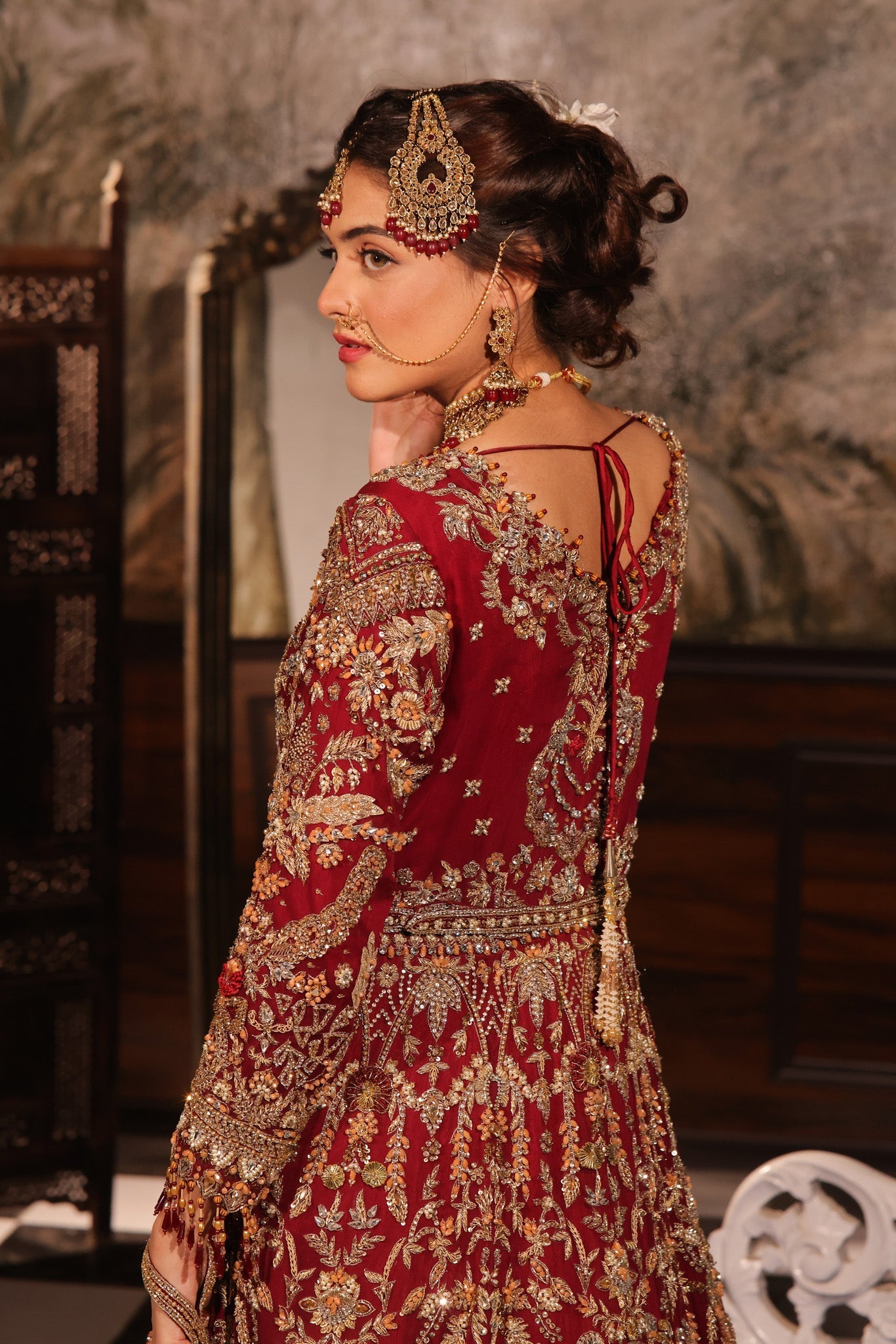 Karigur Ruhani — back view of the red bridal gown showing the embroidered dupatta drape.