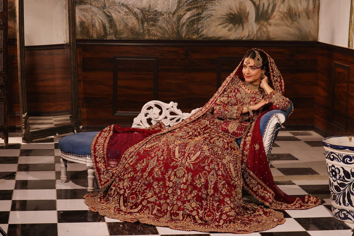 Karigur Ruhani red chiffon bridal gown and lehenga, full bridal styling with a potli bag.