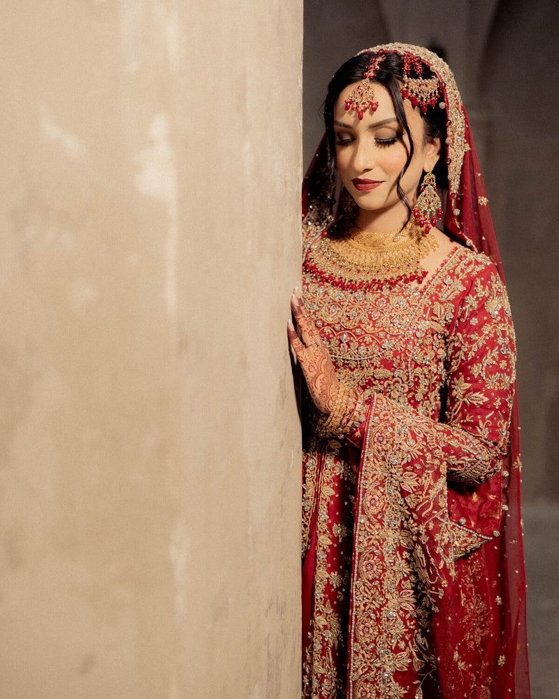 Bride in a red and gold farshi bridal with zardozi embroidery, by Karigur, Toronto